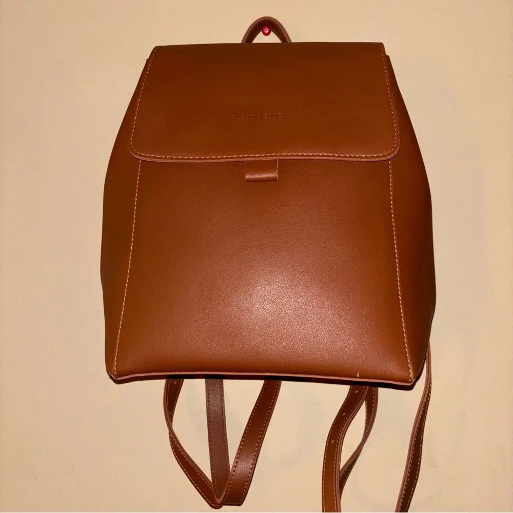 Claudia Canova Unlined Flapover Backpack Tan Faux Leather Minimalist